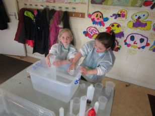 Ms. Swift's Senior Infants enjoying a wet and wonderful maths morning