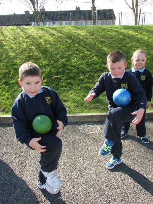 Mrs. Cullinan's Junior Infants enjoying P.E. outdoors!